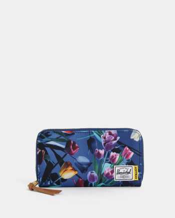 Tmavě modrá dámská květovaná peněženka Herschel Supply Thomas